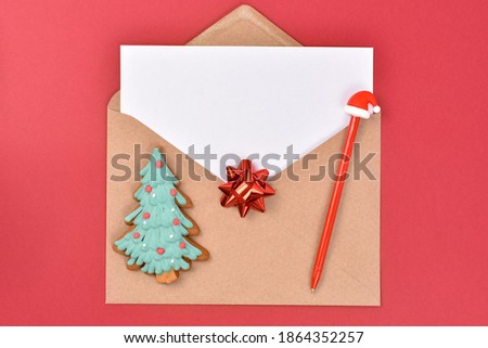 Christmas or New Year wish list, composition on red background. Mock-up. Greeting card, flat lay. Write a letter to Santa. Copy space.