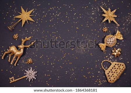 Beautiful Golden sparkling Christmas decoration on black Glitter background. Flat lay design. Copy Space.