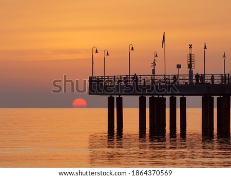 bridge in the sunset in versilia Royalty-Free Stock Photo #1864370569