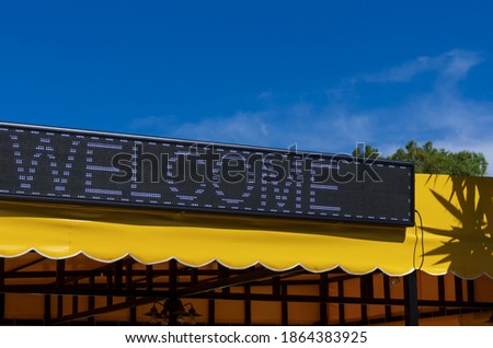 Led signboard with a commonly used luminous inscription in english 'welcome' (no trademark or label)