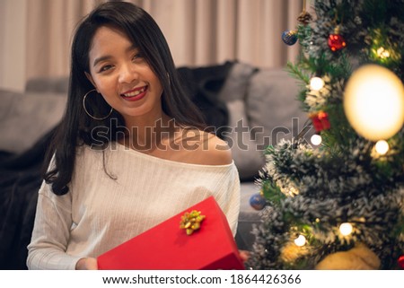 Woman with christmas gifts box for celebrating Christmas at home. Merry Christmas and New year eve.