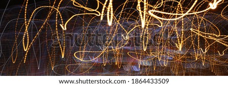 Focused photo on colorful spirals of light at nighttime