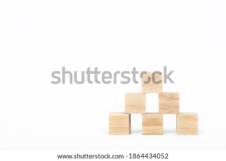 Group of wooden cube blocks on white background with copy space
