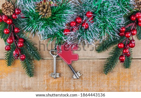 Beautiful Christmas background: decorative house and key to the lock. Concept of finance and housing loans. Top view