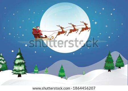 Santa Claus with his Reindeer fly through the Night Sky
