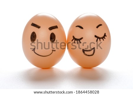 egg faces of lovely couple on white with clipping path