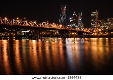 Downtown Portland Oregon at night showing river and skyline