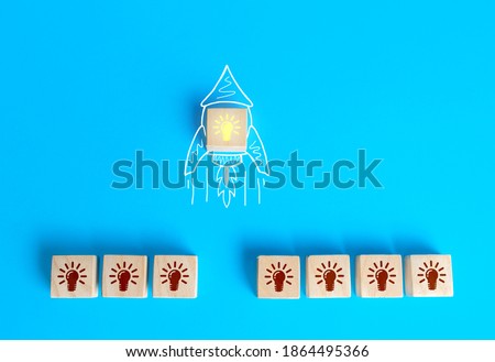 Block with the idea light bulb took off on an imaginary rocket doodle. Developing startup. Choosing best idea. Success investment. Business accelerator. Optimal solution. Creativity Royalty-Free Stock Photo #1864495366