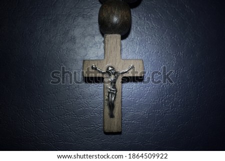 wooden crucifix on a rosary close up                               