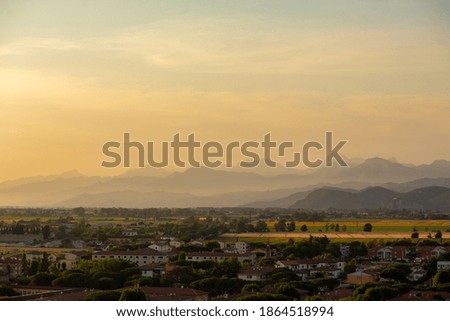 Urban landscape, view of the city and mountains from a height.