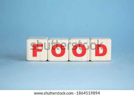 food . concept. Word written with wooden cubes. Education, business, medical , quality control. Blue background