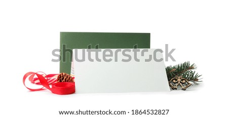 Blank greeting cards and Christmas decor on white background, space for text