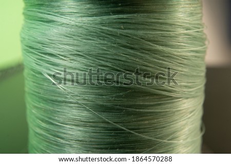 Close up photo of a green fishing line