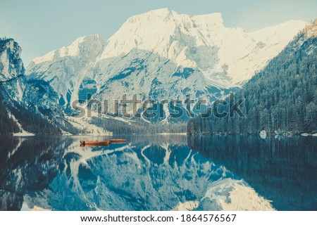 Lago di Braies. Lake Braies (Lago di Braies) in Dolomites Mountains. Boats on the Braies Lake in Dolomites mountains, Sudtirol, Italy, Europe. Beautiful lake in the italian alps. Royalty-Free Stock Photo #1864576567