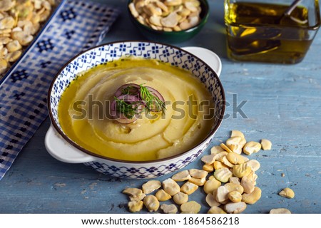 Taditional fava with olive oil. Mashed broad beans fava appetizer. Royalty-Free Stock Photo #1864586218