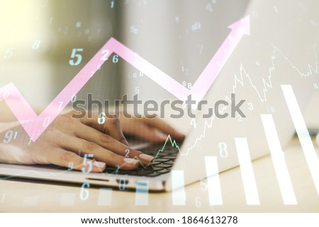 Multi exposure of abstract creative financial graph with upward arrow and hand typing on laptop on background, forex and investment concept