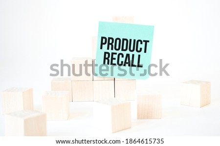 Text Product Recall writing in green card cube ladder. White background. Business concept