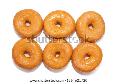 grouped fresh donuts isolated on white