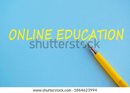 Conceptual hand writing showing Online Education. Business photo showcasing kind of learning that takes place via the Internet. Yellow text and briht blue background.