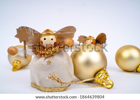 fairy toys with christmas decorations on white background