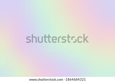 Holographic foil. Rainbow texture. Iridescent background. Neon gradient. Hologram effect. Sparkly metal texture. Soft backdrop for design prints. Silver radiance background. Metallic pattern. Vector Royalty-Free Stock Photo #1864684321
