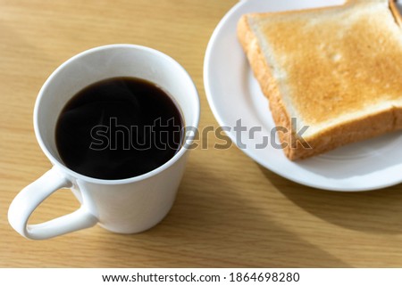 Image of breakfast (bread, coffee)
