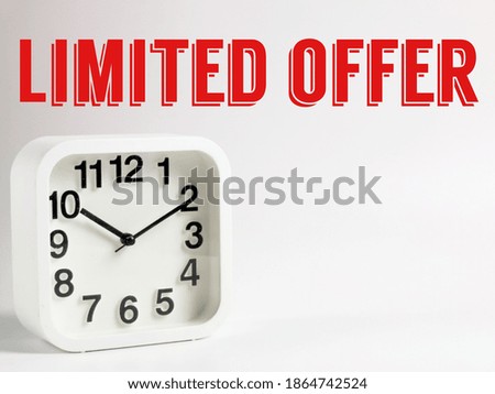 Selective focus on alarm clock with phrase limited offer isolated on white background.Business concept.