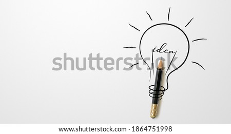 Black colour pencil with outline light bulb and word idea on white paper background. Creativity inspiration ideas concept