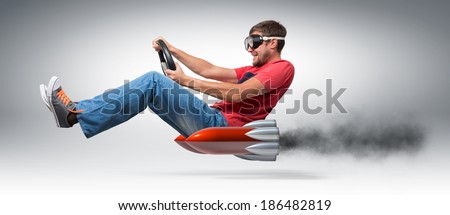 Funny man car driver with a wheel, concept of alternative transport  Royalty-Free Stock Photo #186482819