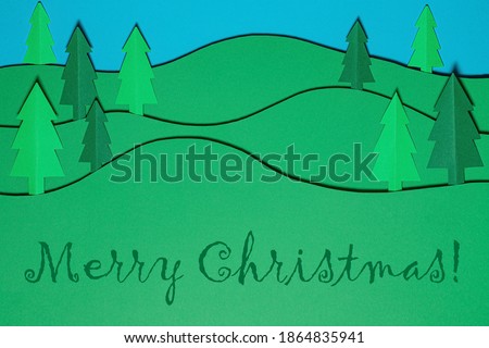 Christmas tree paper cutting design papercraft card. Paper cut Christmas trees. Creative design of christmas background with paper fir tree. The art picture with forest, christmas fir. paper craft.