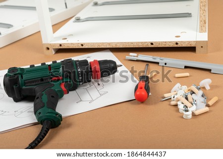 Close up picture of carpenter tools for furniture assembling at home