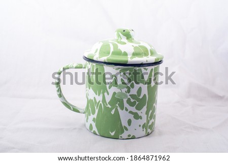Blirik cups or cangkir blirik are one of the rare vintage items used to brew tubruk tea. On white background.horizontal version of the photo
