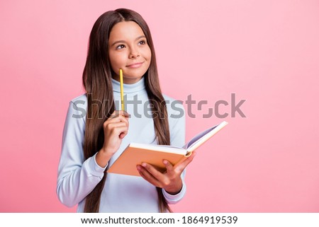 Portrait of attractive minded cheery brainy girl writing notes copybook thinking copy space isolated over pink pastel color background Royalty-Free Stock Photo #1864919539