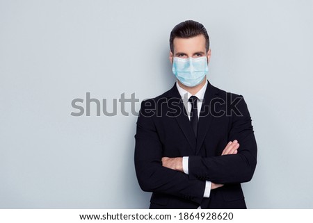 Photo of serious focused confident man expert wear medical mask crossed arms isolated gray color background Royalty-Free Stock Photo #1864928620