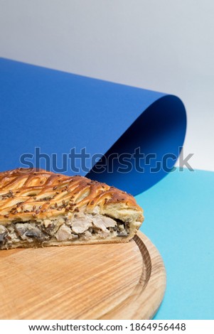 Mushroom pie on a bright background, a rocky place to add text.  Delicious cake in a bright design style.