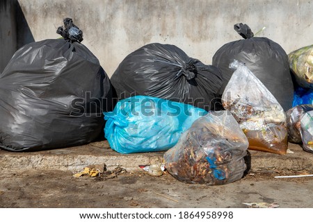 Garbage bag plastic and waste City in the garbage heap of garbage 
photography background texture pollution problem by a litter of plastic in the city 
sloppy trash carelessness of the people.