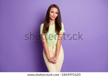 Photo portrait of modest woman isolated on vivid purple colored background Royalty-Free Stock Photo #1864991620