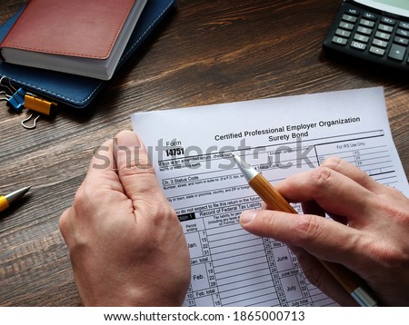 Form 14751 Certified Professional Employer Organization Surety Bond sign on the page.
 Royalty-Free Stock Photo #1865000713