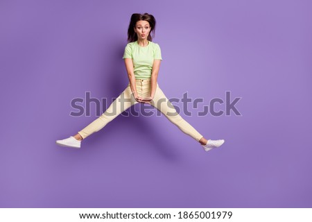 Full length body size view of her she nice attractive pretty cute cheerful cheery teen girl jumping having fun fooling pout lips isolated bright vivid shine vibrant lilac violet color background