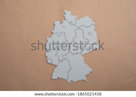 A top view shot of a paper cut of Germany