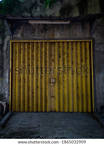 yellow roller shutter door that is closed