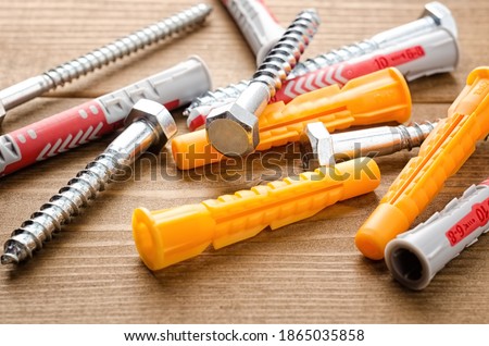 Screws with wall plugs ,dowels , wall anchors.