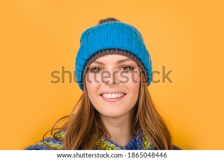 Winter clothes. Smiling woman in warm hat. Vogue. Winter outfit. Mood. Different emotions. Feeling and emotions. Face expression.