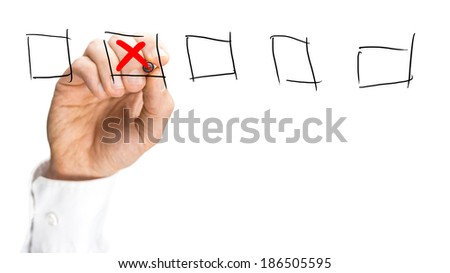 Man placing a red cross in a set of hand-drawn check boxes on a virtual interface over a white background with copyspace, close up view of his hand.