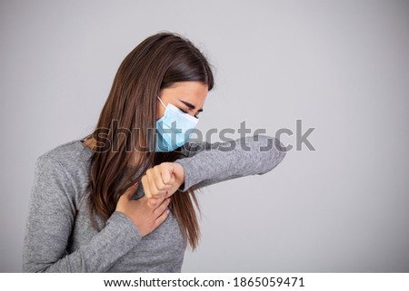 Coronavirus Pneumonia. Sick Woman Coughing Having Breathing Difficulty Standing On White Studio Background, Wearing Medical Mask. Epidemic pandemic rapidly spreading coronavirus 2019