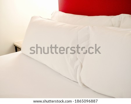 white pillows decoration on bed in bedroom interior