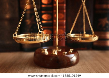 Vintage law scale over wooden table