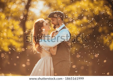 Photo young loving wedding couple hugging at sunset. Minimalist Hipster Wedding