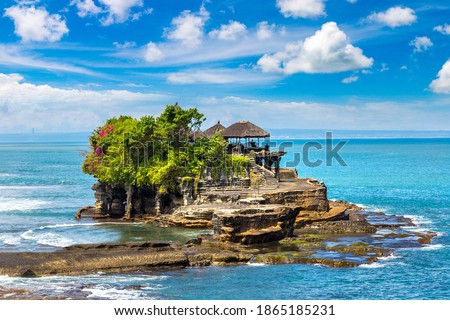 Panoramic view of Tanah Lot temple on Bali, Indonesia in a sunny day Royalty-Free Stock Photo #1865185231