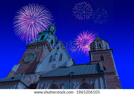 Celebratory fireworks for new year over Wawel Castle in Krakow or cracow - Poland, during last night of year. Christmas atmosphere. 